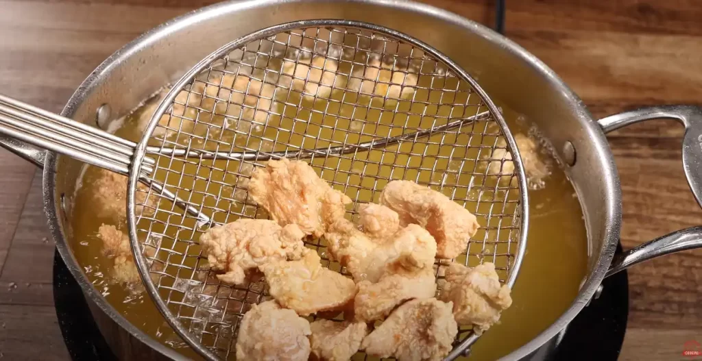 frying the chicken for orange chicken 